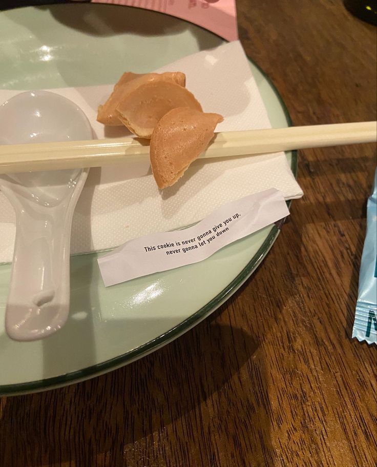 chopsticks with peanut butter on them sitting on a plate