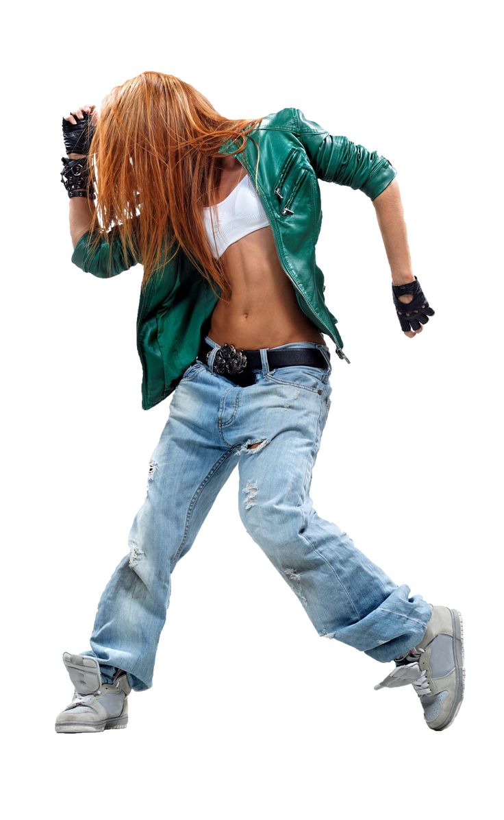 a woman in jeans and a green jacket is dancing with her hands behind her back