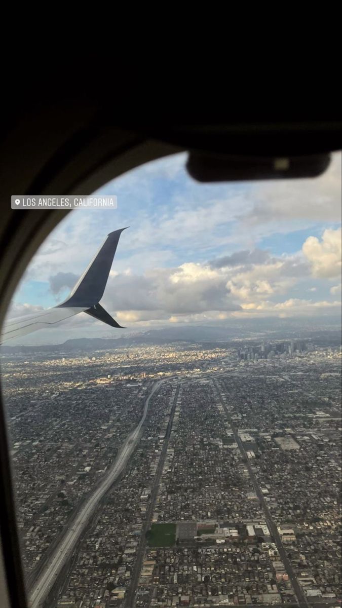 the view from an airplane window looking down on a city