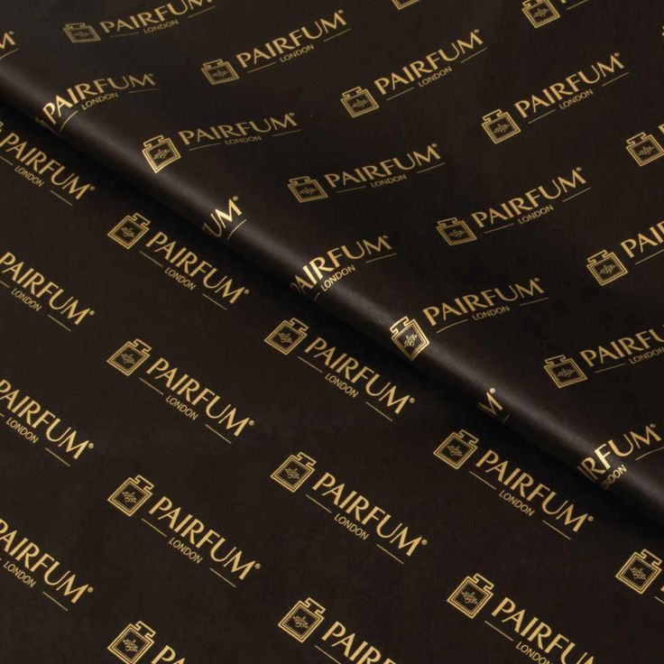 black and gold foiled wrapping paper with the word parfum on it's side