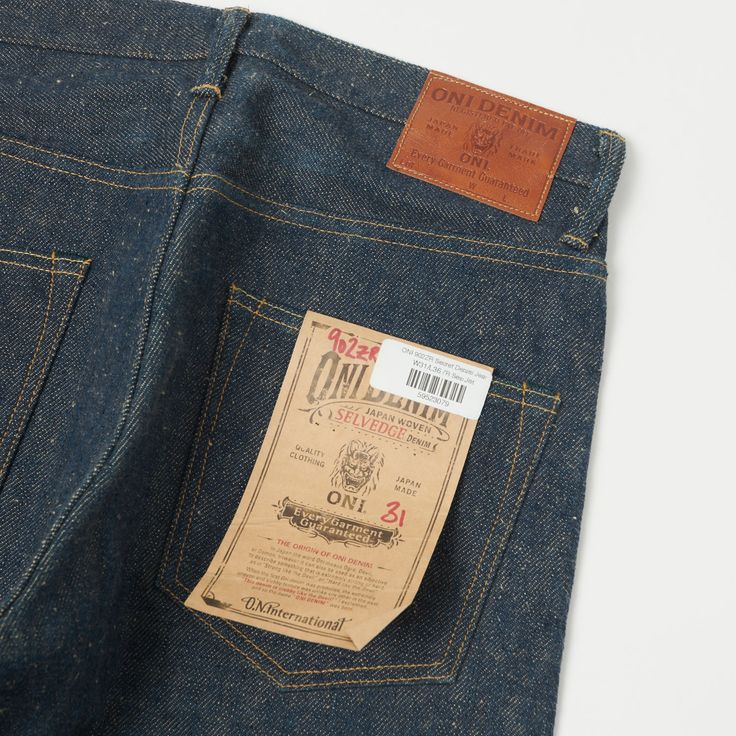 ONI’s 902 jean is a relaxed tapered model with a classic 5-pocket top consruction. This model features a mid rise which sits comfortably on the waist and gives a little more room in the thigh before tapering gradually down to the ankle, and to add a little more interest, they have crafted this model from their mysterious ‘secret denim’. This 20oz low tension denim has the unique slubby patina that we have come to expect from the brand and is paired with a beige dyed weft which flecks through the surface of the fabric at irregular intervals, giving the denim a raw heritage feel. The fabric has been expertly woven in the iconic ONI fashion which ensures that as the denim is broken in by the wearer, the cotton softens and the indigo fades away in a manner unique to the individual. The manufac Model Features, Tapered Jeans, Pocket Top, Patina, Mid Rise, Fabric