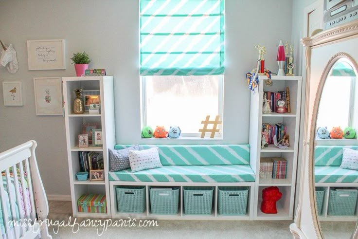 a baby's room with bookshelves and toys