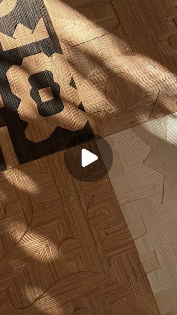 the floor is made up of wood and has black letters on it that spell out numbers