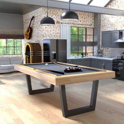 a pool table in the middle of a kitchen