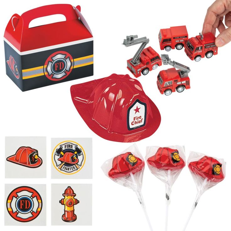 a red fireman's hat and some candy lollipops with stickers