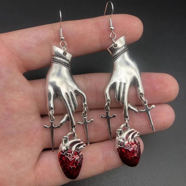 ♡ Knife Cut Heart Anatomical Earrings ♡ This Detail-Oxidized Pulmonary Veins Silver Anatomical Heart Earrings Are The Most Dreamy Real Heart Pair! Our "Knife Cut Heart Anatomical Earrings" Are A Mad Gorgeous Way To Express Your Love And Makes Your Look Truly Standout! Wear Your Heart Out On Your Jewelry (And Ears!) Or Gift-Wrap It For Friends And Loved Ones Who'll Adore Your Heartfelt Present (Also Available As An Option). Size: 3 inch from hooks down Weight: 0.2 oz for a pair Material: Lab Agat Knife Jewelry, Heart Anatomical, Vamp Goth, Real Heart, Dagger Earrings, Ideal Closet, Earrings Gothic, Gothic Vintage, Silver Heart Earrings