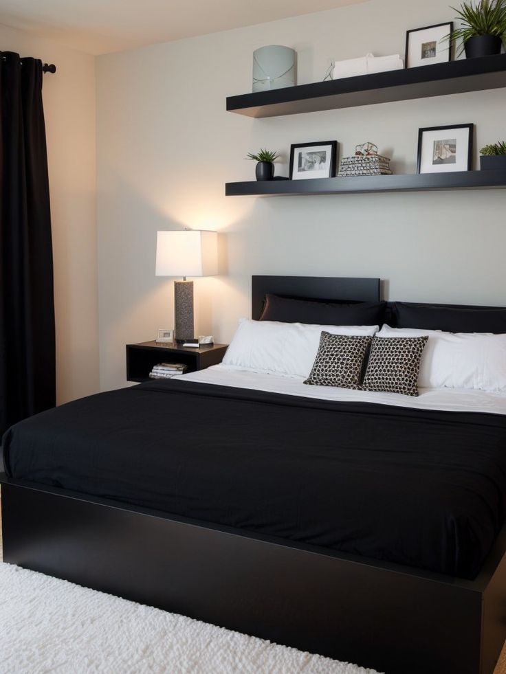 a bedroom with black and white decor on the walls