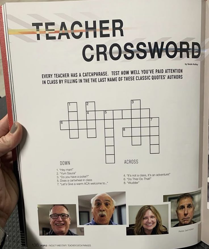 a person holding up a crossword book