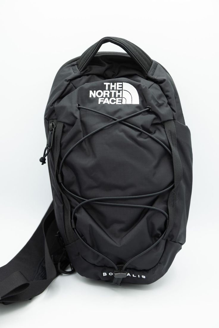 This The North Face Borealis Sling Pack in Black has simplified organization, adjustable shoulder strap with a phone pocket, and is comfortable to wear. Great for class or traveling, you’ll love this! Features: The North Face Style: NF0A52UP-KY4 Color: TNF Black The North Face sling pack Adjustable padded shoulder strap with pocket Large main compartment with mesh pocket and key clip Side fleece-lined zipper pocket External bungee-compression system One durable external water bottle pocket The North Face logo on front Dimensions: 8.65" X 4.15" X 13.5" The North Face Borealis, North Face Borealis, Face Style, Sling Pack, Face Logo, Key Clip, The North Face Logo, North Face, Zipper Pocket