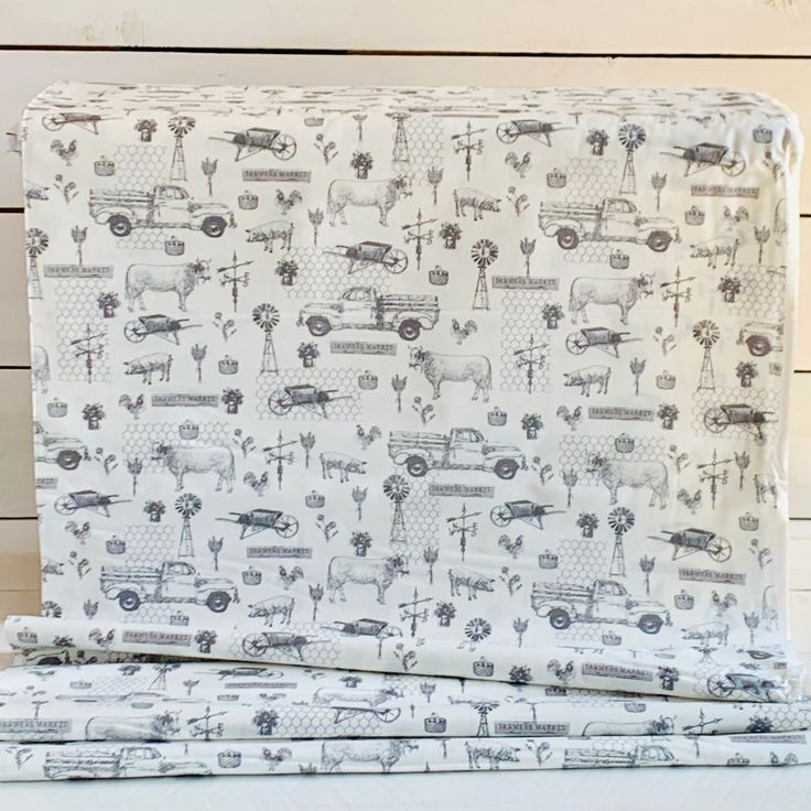 two sheets with cars and trucks on them