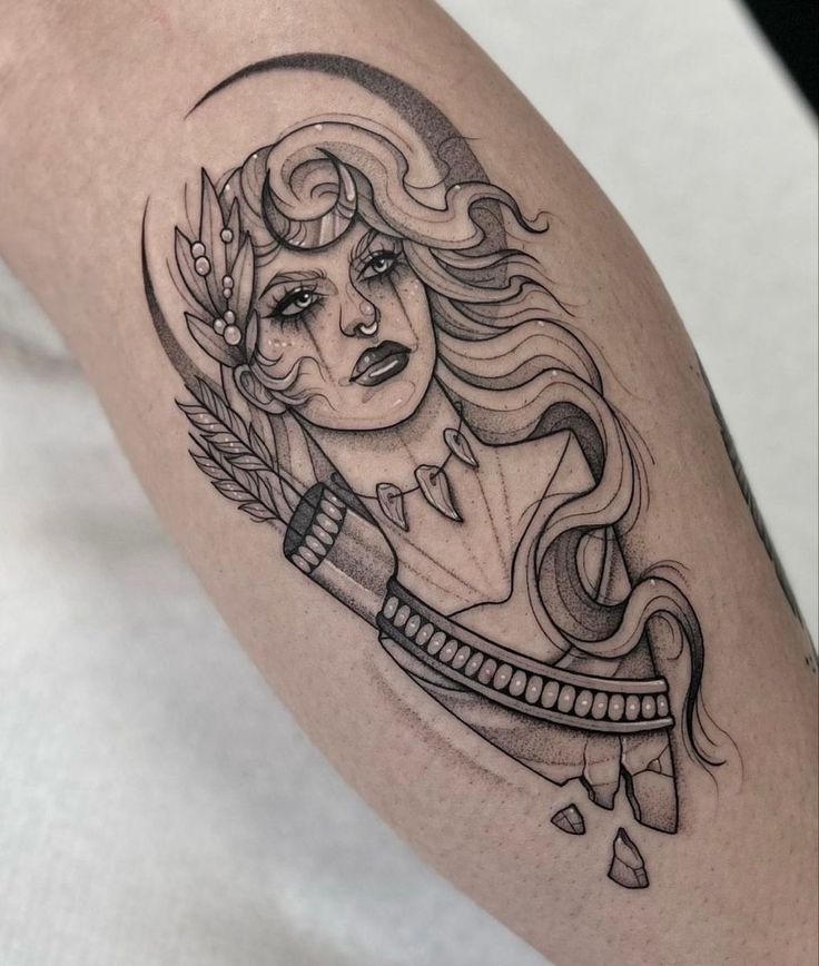 a woman's arm with a tattoo on it and an arrow in the middle