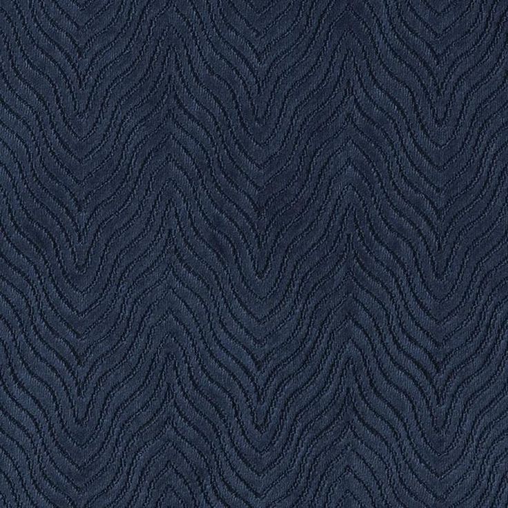 an upholstered blue fabric with wavy lines