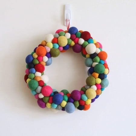 a colorful wreath hanging on the wall