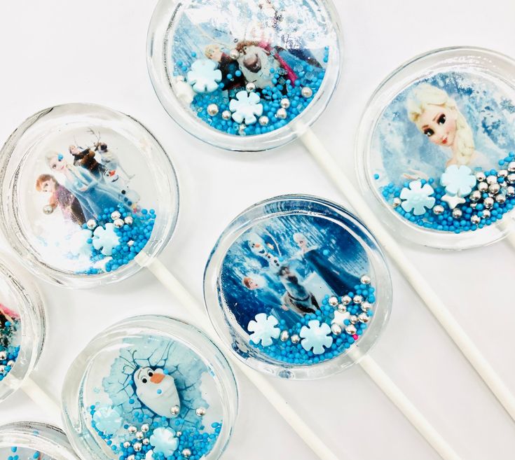 six frozen princess lollipops with snowflakes on them