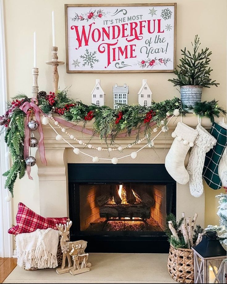 a fireplace decorated for christmas with stockings and stockings hanging from the mantel above it