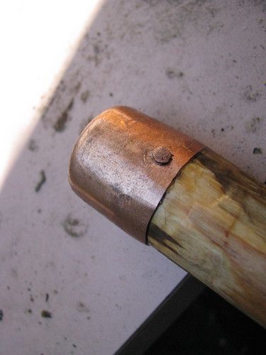 a close up of a wooden handle on a door