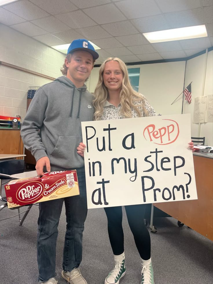 a man and woman holding up a sign in an office cubicle that says put a pep in my step at prom