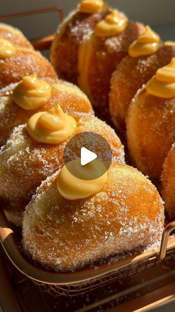 a basket filled with lots of donuts covered in icing