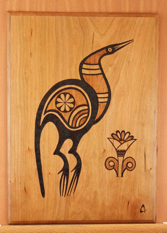 an image of a bird carved into wood