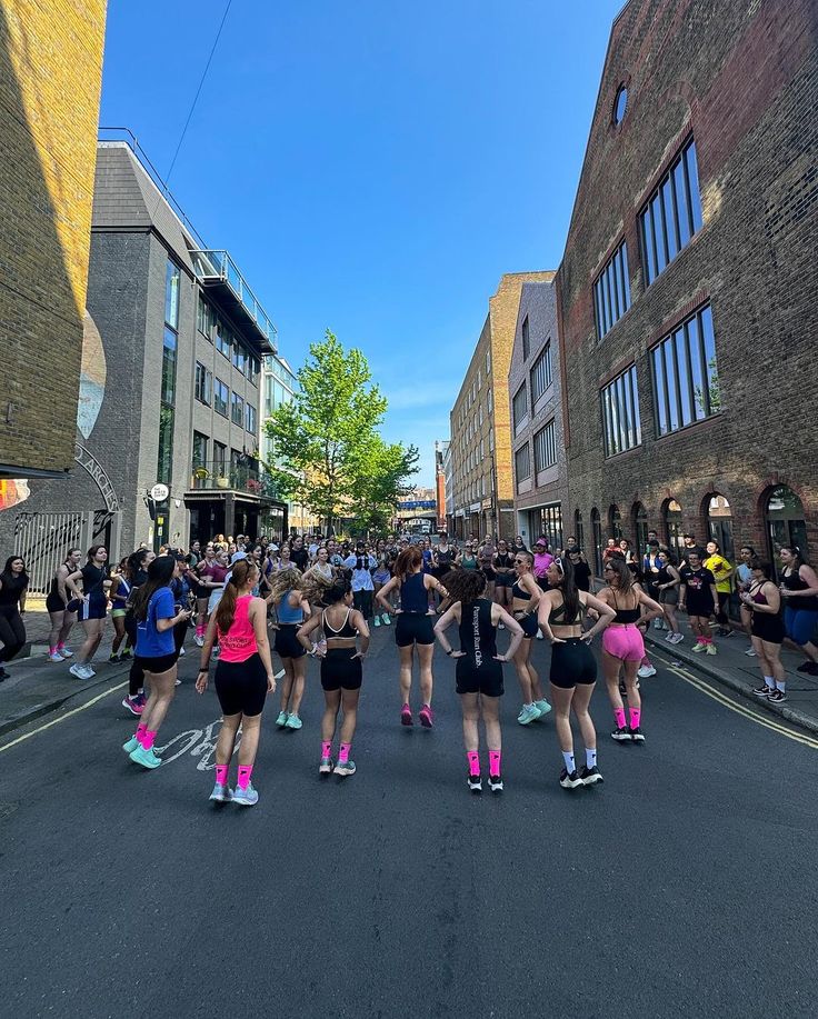 a group of people that are standing in the middle of a street with roller skates