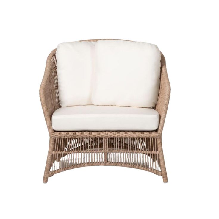 a wicker chair with white cushions on the seat and back cushion is upholstered