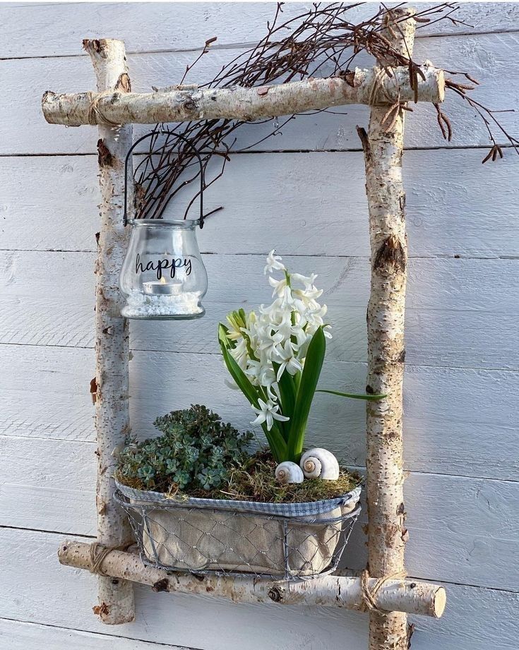 an old ladder is used as a planter for succulents and flowers