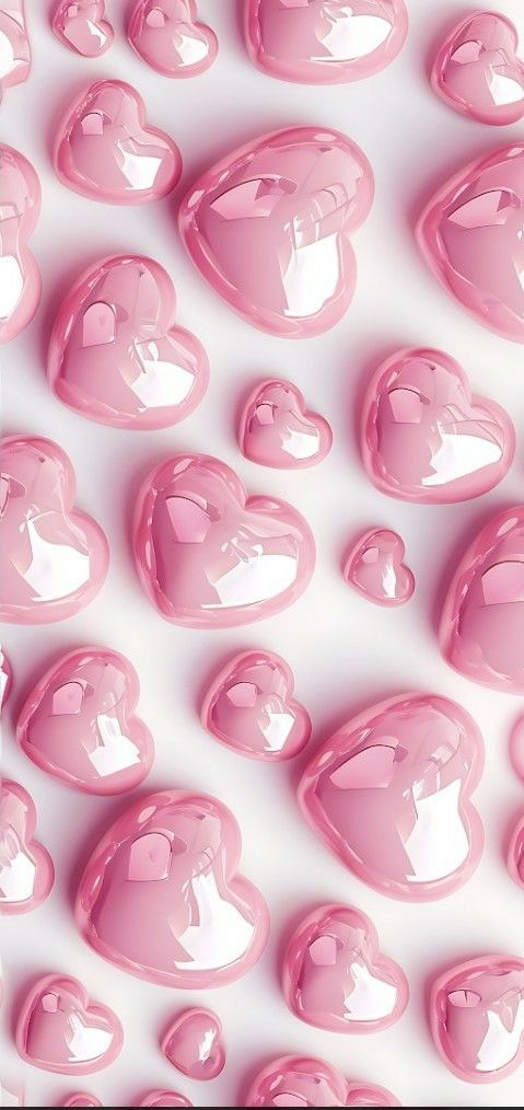 many pink hearts are arranged in the shape of heart shapes on a white surface, as if for valentine's day or other special occasion