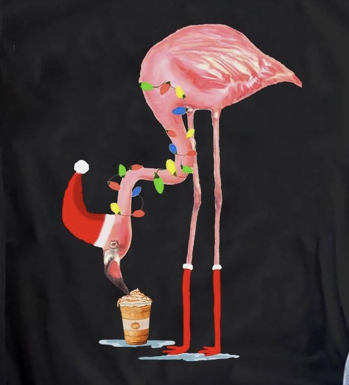 a pink flamingo standing next to a green martini