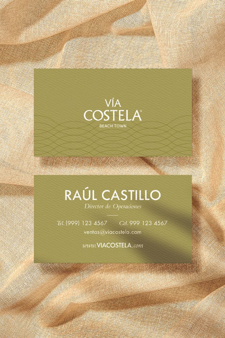 two business cards with gold foil on them