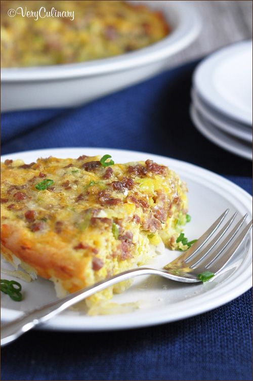 a piece of quiche on a plate with a fork