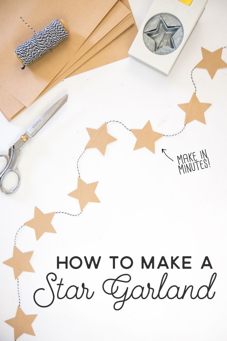 how to make a star garland with scissors and glue on the table next to it