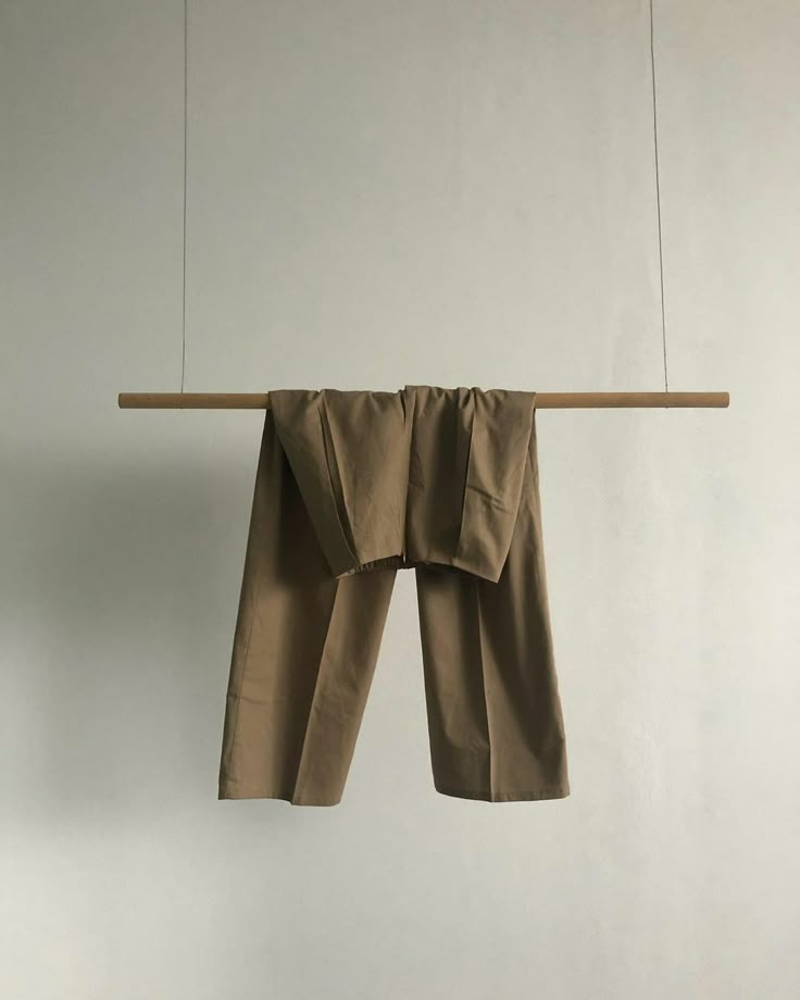 a pair of pants hanging from a clothes line