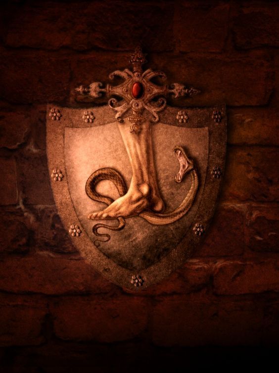 a coat of arms with an octopus in the center on a brick wall, surrounded by filigrees