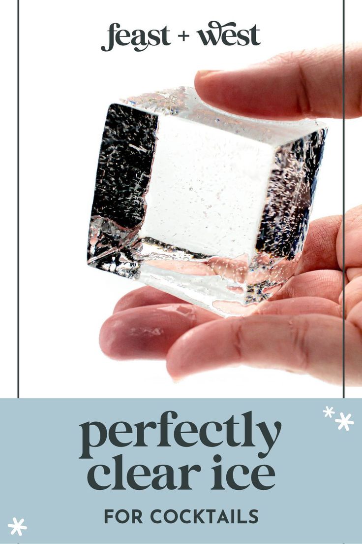 a person holding an ice cube in their hand with the text perfectly clear ice for cocktails