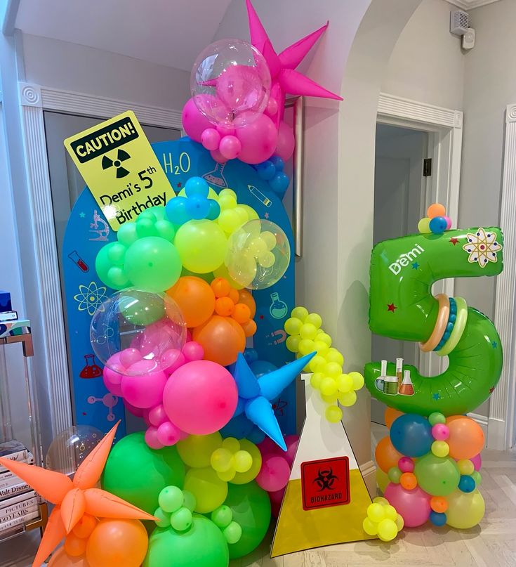 balloons are arranged in the shape of letters and animals