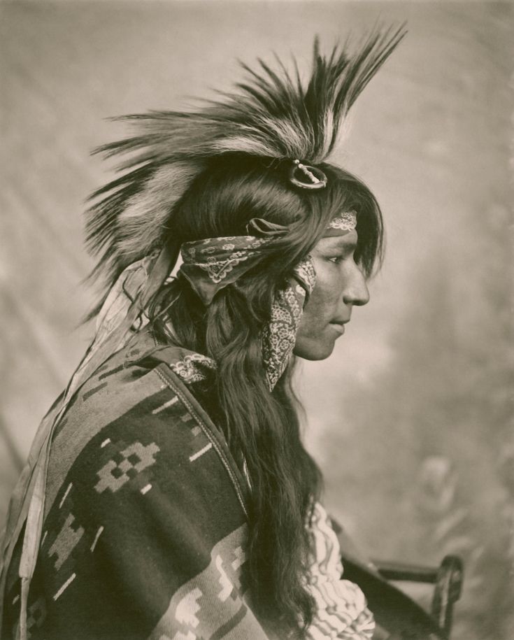 an old black and white photo of a native american woman