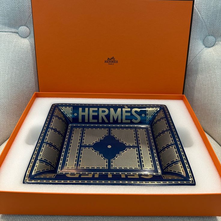 New/Unused. Change Tray In Porcelain - Velvet Goatskin Base - Decorated Using Chromolithography - "Herms Paris" Stamped Base Made In France Designed By Benot-Pierre Emery Measures 8.3" Long X 6.7" Wide Hermes Home Decor, Hermes Decor, Hermes Blanket, Hermes Home, Accent Tray, Hermes Perfume, Gingham Jacket, Mirrored Wallpaper, Hermes Box