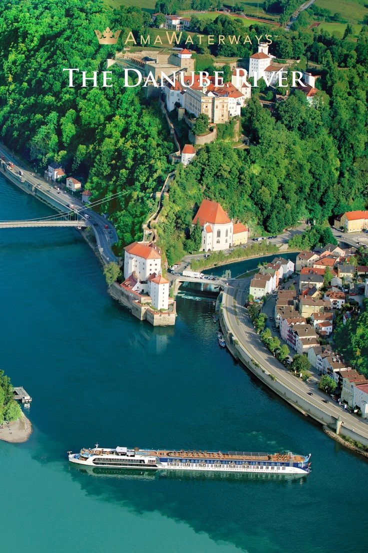 an aerial view of a river running through a town