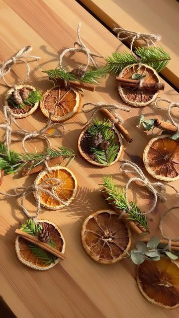 dried oranges are arranged on a wooden table