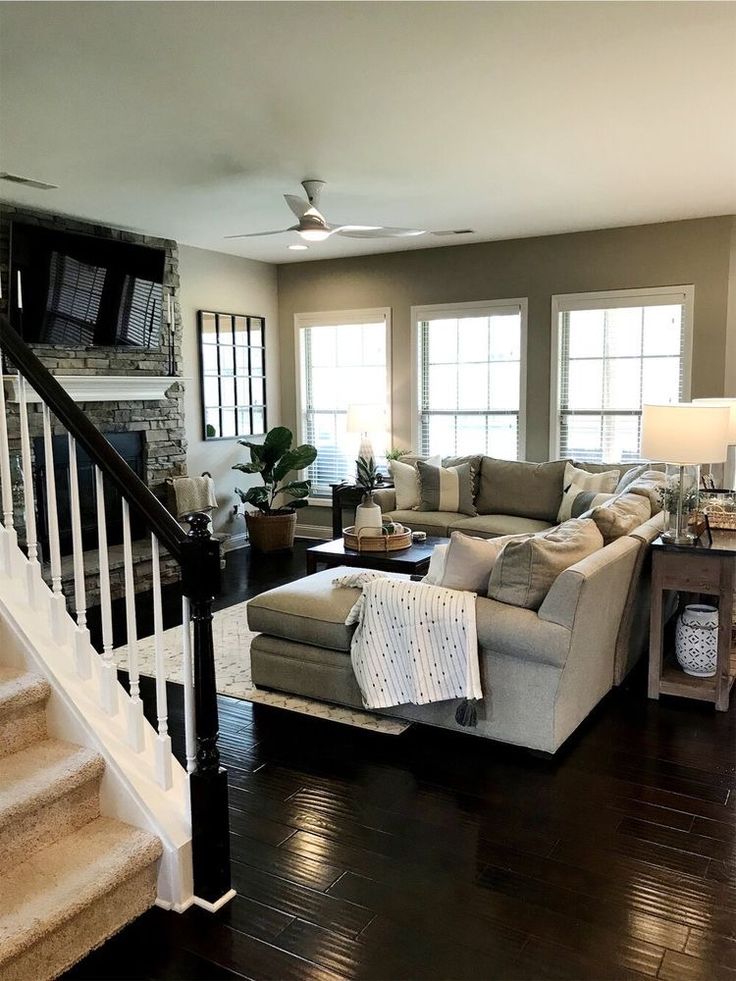 a living room filled with furniture and a fire place