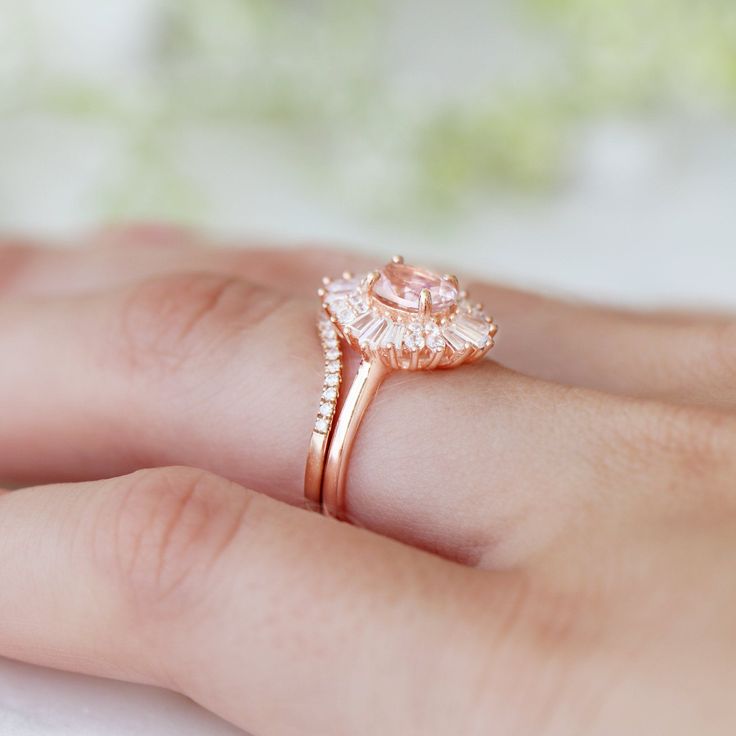 Beautiful Victoria Morganite Art Deco Ring ►Vintage Inspired design ►Base Metal: Sterling Silver (925) ►Plating: 14K Rose Gold ►Accented With Simulated Diamonds (CZ) ►Average band width: 1.8 mm ►Halo size: 13.5 mm x 12.1 mm Main Stone: Morganite Gemstone Creation: Lab-Created Stone Shape: Oval Cut Gem size: 7.0 x 5.0 mm Carat Weight: 0.76 ct. (Approx.) ►This ring can be customized to natural morganite, or any other gemstone of your choice. Please contact us if you have special requests. ►Please Pink Gold Rose Cut Diamond Wedding Jewelry, Pink Gold Jewelry With Rose Cut Diamonds For Weddings, Pink Cubic Zirconia Halo Ring For Wedding, Pink Brilliant Cut Wedding Rings, Classic Pink Cluster Ring For Anniversary, Pink Round Halo Ring For Wedding, Pink Round Halo Wedding Ring, Rose Gold Marquise Cut Cluster Ring For Gift, Rose Gold Cubic Zirconia Halo Ring For Anniversary