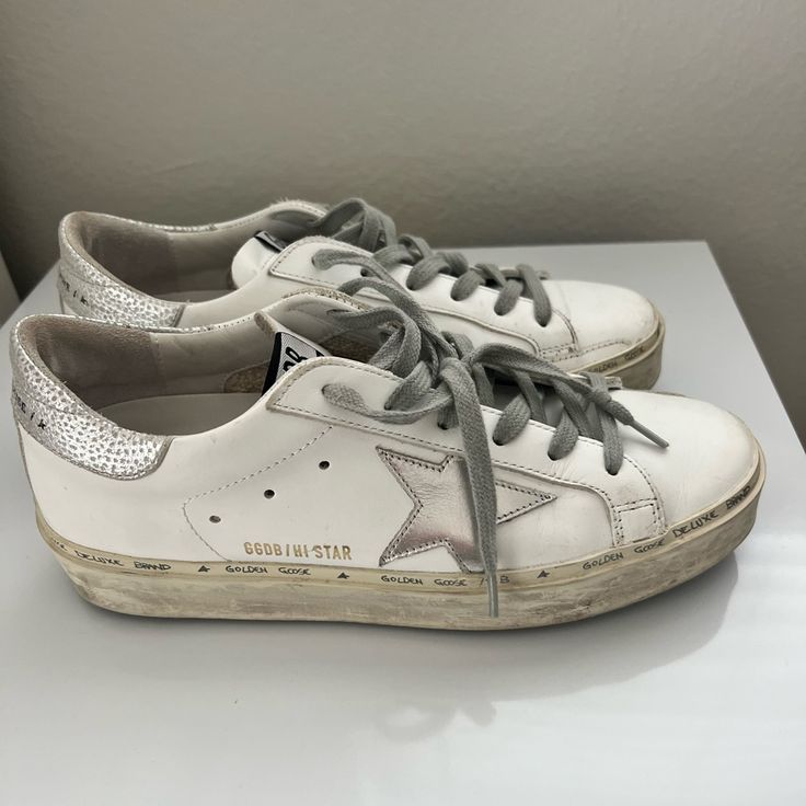 Golden Goose High Star With Star And Heel Tab In Metallic Silver. High Star Golden Goose, Shoes Golden Goose, Goose Shoes, Golden Goose Shoes, Golden Goose, Womens Shoes Sneakers, Silver Color, Metallic Silver, Women Shoes