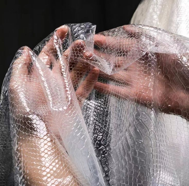 a woman wrapped in plastic covering her body