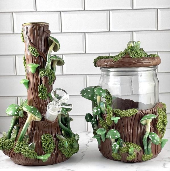 two glass jars with plants growing out of them