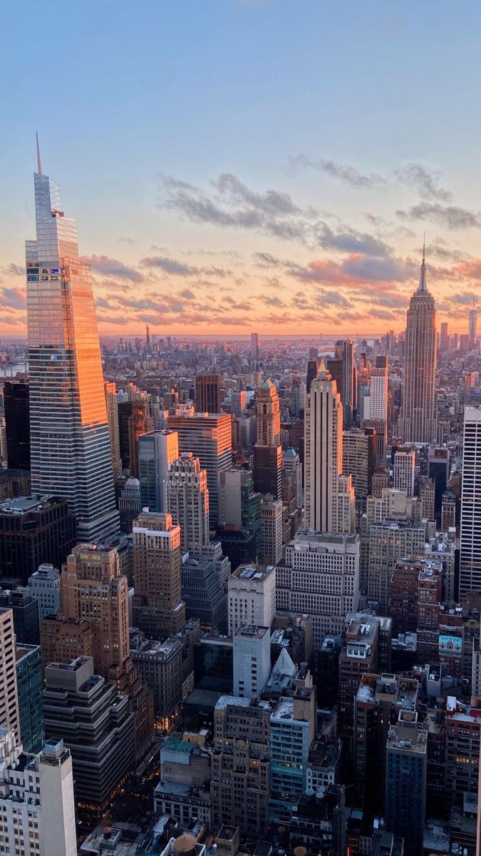 an aerial view of the city with skyscrapers and other tall buildings in the foreground