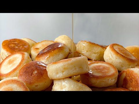 bread rolls are being drizzled with honey