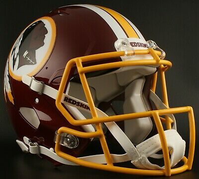 a football helmet with the washington state rams on it's side and gold trim