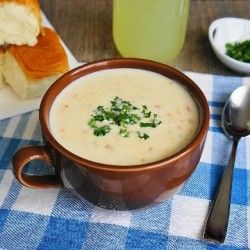 a bowl of soup on a blue and white checkered table cloth