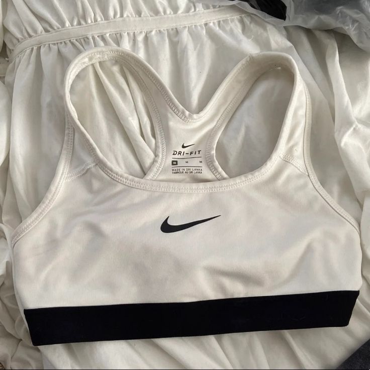 White Nike Sports Bra, Never Worn Perfect Condition. Size Medium But Fits Like A Small Or Xs White Sports Bra For Gym With Medium Support, White Sports Bra With Medium Support For Workout, White Medium Support Sports Bra For Workout, White Racerback Moisture-wicking Activewear, Nike Sporty Sports Bra For Light Activities, Nike Sporty Sports Bra For Light Sports, White Racerback Activewear For Gym, White Racerback Activewear For Sports, White Go-dry Functional Sports Bra