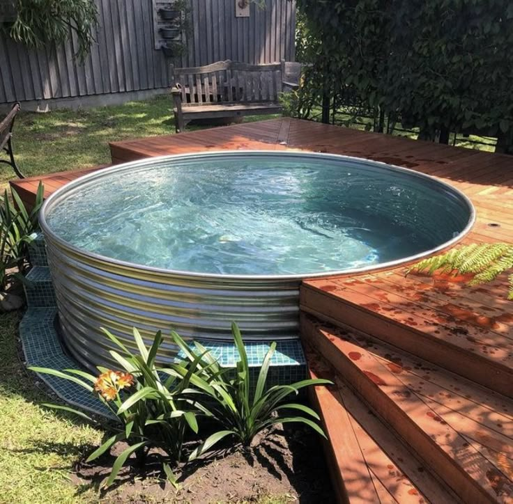 an above ground swimming pool with steps leading up to it